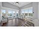 This sitting room features waterfront views, modern decor, and furniture for a calming aesthetic at 1885 Pompano Dr., Garden City Beach, SC 29576
