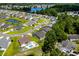 A view showcasing the landscape with an in-ground pool and neighborhood lake at 216 Palm Terrace Loop, Conway, SC 29526