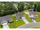A high angle view showcases the house, the neighborhood, and the nearby pond at 216 Palm Terrace Loop, Conway, SC 29526