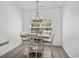 Bright dining area featuring a modern chandelier and a stylish four-chair dining set at 216 Palm Terrace Loop, Conway, SC 29526
