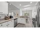 Bright kitchen with stainless steel appliances, granite counters, and a view to the dining area at 216 Palm Terrace Loop, Conway, SC 29526