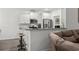 Modern kitchen with stainless appliances and granite countertops, adjacent to the living room at 216 Palm Terrace Loop, Conway, SC 29526