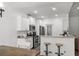 Well-equipped kitchen featuring stainless steel appliances, granite counters, and stylish bar stools at 216 Palm Terrace Loop, Conway, SC 29526