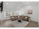 Spacious living room with high ceilings, neutral decor, and modern leather sofa at 216 Palm Terrace Loop, Conway, SC 29526