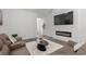 Bright living room featuring a modern electric fireplace, flat screen TV, and brown leather sofa at 216 Palm Terrace Loop, Conway, SC 29526