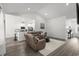 Open-concept living room featuring modern lighting, neutral colors, and flows into the kitchen at 216 Palm Terrace Loop, Conway, SC 29526