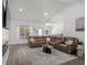 Spacious living room with vaulted ceiling, fireplace, and contemporary furnishings at 216 Palm Terrace Loop, Conway, SC 29526