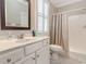 Bathroom featuring a stylish vanity, marble countertop, and walk in shower at 226 Red Tail Hawk Loop, Pawleys Island, SC 29585