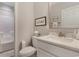 Bathroom features white vanity, marble countertop, a commode, and updated fixtures at 226 Red Tail Hawk Loop, Pawleys Island, SC 29585