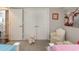 Bedroom with closet and a plush chair, creating a cozy space at 226 Red Tail Hawk Loop, Pawleys Island, SC 29585