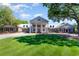Grand home exterior featuring columns, manicured lawn, and stately design at 226 Red Tail Hawk Loop, Pawleys Island, SC 29585