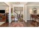 Inviting foyer with dark hardwood floors, decorative rug, and view of the staircase and living area at 226 Red Tail Hawk Loop, Pawleys Island, SC 29585