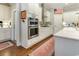 Well-equipped kitchen with stainless steel appliances, white cabinets, and decorative accents at 226 Red Tail Hawk Loop, Pawleys Island, SC 29585