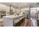 Modern kitchen features an island with seating, stainless appliances, and white cabinetry at 226 Red Tail Hawk Loop, Pawleys Island, SC 29585