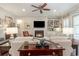 Warm living room with a fireplace, built-in shelves, and neutral decor at 226 Red Tail Hawk Loop, Pawleys Island, SC 29585