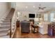 Cozy living room with a fireplace, built-in shelves, and hardwood floors at 226 Red Tail Hawk Loop, Pawleys Island, SC 29585