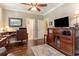 Cozy home office with wood floors, a ceiling fan, and built-in storage solutions at 226 Red Tail Hawk Loop, Pawleys Island, SC 29585