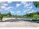 Scenic view of community pond with fountain and landscaping at 226 Red Tail Hawk Loop, Pawleys Island, SC 29585