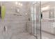 Walk-in shower features glass doors and gray tile, providing a modern spa-like experience at 226 Red Tail Hawk Loop, Pawleys Island, SC 29585