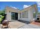 An open back patio featuring a textured concrete pad and sliding door to the home at 23 Robert Conway Ct., Georgetown, SC 29440