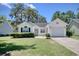 Quaint single-Gathering home with a tidy lawn, driveway and attached one car garage at 23 Robert Conway Ct., Georgetown, SC 29440