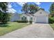 Charming single-story home with a well-manicured lawn, attached garage and lovely landscaping at 23 Robert Conway Ct., Georgetown, SC 29440