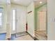 Bright foyer features a front door, marble floors, coat rack and views to other rooms at 23 Robert Conway Ct., Georgetown, SC 29440