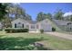 Charming single-story home featuring a well-manicured lawn and inviting curb appeal on a sunny day at 23 Robert Conway Ct., Georgetown, SC 29440