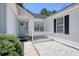 Inviting home entrance with a charming door, white picket fence and landscaped surroundings at 23 Robert Conway Ct., Georgetown, SC 29440