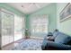 Cozy sitting room is bathed in natural light, features sliding glass door, and stylish blue accents at 23 Robert Conway Ct., Georgetown, SC 29440