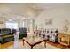 Spacious living room with vaulted ceiling is open to dining area and features hardwood floors at 23 Robert Conway Ct., Georgetown, SC 29440