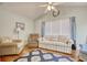 Comfortable sitting room is brightened by a large window and is furnished with a patterned rug at 23 Robert Conway Ct., Georgetown, SC 29440
