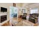 Bright and airy living space features a fireplace, hardwood floors, and comfortable seating at 23 Robert Conway Ct., Georgetown, SC 29440