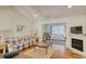 Inviting living room features a cozy fireplace, vaulted ceilings, and hardwood flooring at 23 Robert Conway Ct., Georgetown, SC 29440