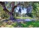 Lush greenery frames the picturesque view of the neighborhood homes next to the pond at 23 Robert Conway Ct., Georgetown, SC 29440