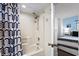 Functional bathroom features a shower-tub combo with a patterned curtain, providing a practical space at 2501 S Ocean Blvd. # 508, North Myrtle Beach, SC 29582