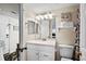 Well-lit bathroom featuring a single sink vanity, decorative mirror, and convenient toilet placement at 2501 S Ocean Blvd. # 508, North Myrtle Beach, SC 29582