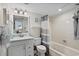 Cozy bathroom features a shower-tub combo, a white sink vanity, and beachy accents at 2501 S Ocean Blvd. # 508, North Myrtle Beach, SC 29582
