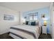 Serene bedroom with a queen bed, nautical decor, and soft lighting for a peaceful escape at 2501 S Ocean Blvd. # 508, North Myrtle Beach, SC 29582
