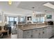 Modern kitchen featuring counter seating open to the living room and ocean views at 2501 S Ocean Blvd. # 508, North Myrtle Beach, SC 29582