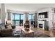 Living room featuring a fireplace, tv, and ocean views at 2501 S Ocean Blvd. # 508, North Myrtle Beach, SC 29582