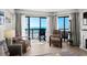 Cozy living space with comfortable seating and balcony access with an ocean view at 2501 S Ocean Blvd. # 508, North Myrtle Beach, SC 29582