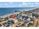Charming coastal community with colorful beach houses and a scenic view of the ocean and pier at 301 N Waccamaw Dr. # 311, Garden City Beach, SC 29576