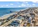 Stunning aerial view of a beachfront community with easy access to the pier and beautiful ocean views at 301 N Waccamaw Dr. # 311, Garden City Beach, SC 29576