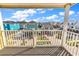 Balcony view of colorful coastal houses and a beautiful blue sky at 301 N Waccamaw Dr. # 311, Garden City Beach, SC 29576