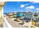 Balcony view of colorful coastal houses and a beautiful blue sky near the beach at 301 N Waccamaw Dr. # 311, Garden City Beach, SC 29576