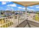 Balcony view of neighborhood houses and clear blue skies at 301 N Waccamaw Dr. # 311, Garden City Beach, SC 29576