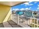 Balcony view of colorful coastal houses and a beautiful blue sky at 301 N Waccamaw Dr. # 311, Garden City Beach, SC 29576