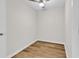 Simple bedroom with a ceiling fan, neutral walls, and durable wood-look flooring at 301 N Waccamaw Dr. # 311, Garden City Beach, SC 29576