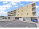 Low angle exterior shot of a modern building with multiple balconies at 301 N Waccamaw Dr. # 311, Garden City Beach, SC 29576